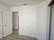 Bedroom with new wood-look flooring and ample natural light at 6636 Old Oxford Ave, Las Vegas, NV 89108
