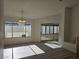 Light-filled dining area with large window and sliding doors to covered patio; bright neutral walls at 6636 Old Oxford Ave, Las Vegas, NV 89108