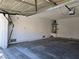 Spacious two-car garage with a clean concrete floor and an operating overhead door at 6636 Old Oxford Ave, Las Vegas, NV 89108