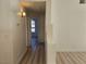Hallway leading to various rooms with wood-look flooring at 6636 Old Oxford Ave, Las Vegas, NV 89108