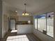The kitchen with bright lighting features an open design, adjacent to a dining area at 6636 Old Oxford Ave, Las Vegas, NV 89108