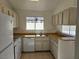 Functional kitchen features updated appliances, bright light, and plentiful counter space at 6636 Old Oxford Ave, Las Vegas, NV 89108