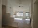 Bright open floor plan with dining area, fireplace, and sliding glass door access to patio at 6636 Old Oxford Ave, Las Vegas, NV 89108