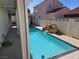 Refreshing backyard pool featuring a rock waterfall and ample space for lounging at 6636 Old Oxford Ave, Las Vegas, NV 89108