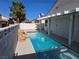 Inviting backyard pool with rock waterfall feature in a well-maintained outdoor space at 6636 Old Oxford Ave, Las Vegas, NV 89108