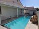 Backyard pool with rock waterfall, covered patio, and plenty of space for enjoying the outdoors at 6636 Old Oxford Ave, Las Vegas, NV 89108