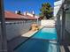Inviting backyard pool with rock waterfall, perfect for relaxation and outdoor entertainment at 6636 Old Oxford Ave, Las Vegas, NV 89108