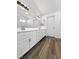 Bathroom with a double sink vanity and modern lighting at 6696 Merced Lake Dr, Las Vegas, NV 89156