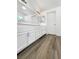 Bathroom with a double sink vanity and modern lighting at 6696 Merced Lake Dr, Las Vegas, NV 89156