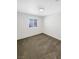 Bright bedroom with neutral carpet and a window with shutter style blinds at 6696 Merced Lake Dr, Las Vegas, NV 89156