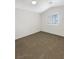 Cozy bedroom with neutral carpet and a window with shutter style blinds for added privacy at 6696 Merced Lake Dr, Las Vegas, NV 89156