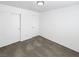 Clean bedroom offers white walls, grey carpet, sliding door closet, and a recessed ceiling light at 6696 Merced Lake Dr, Las Vegas, NV 89156
