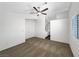 Spacious bedroom with a ceiling fan and walk in closet at 6696 Merced Lake Dr, Las Vegas, NV 89156