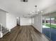 Open living area features wood floors and bright natural light at 6696 Merced Lake Dr, Las Vegas, NV 89156
