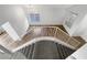 View of staircase with railing, hardwood flooring, carpeted stairs, and white walls at 6696 Merced Lake Dr, Las Vegas, NV 89156