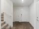 Inviting entryway with durable hardwood floors and staircase leading to the upper level at 6850 Magenta Moon St, North Las Vegas, NV 89086