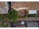 Aerial view highlighting the home's backyard with its patio, landscaping, and nearby pergola at 694 Value Ridge Ave, Henderson, NV 89012