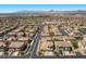 Picturesque aerial view of an established community with tree-lined streets and mountain views at 694 Value Ridge Ave, Henderson, NV 89012