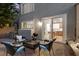 A brick paver patio with an outdoor seating area and barbecue grill, adjacent to the kitchen at 694 Value Ridge Ave, Henderson, NV 89012