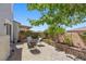 Private backyard oasis with a charming patio area, ideal for enjoying the outdoors at 694 Value Ridge Ave, Henderson, NV 89012