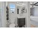 Compact bathroom features a modern vanity, sleek fixtures, and stylish black-and-white flooring at 694 Value Ridge Ave, Henderson, NV 89012