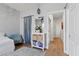 A bedroom featuring a decorative accent wall with a bedside table, and view into hallway at 694 Value Ridge Ave, Henderson, NV 89012