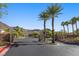 Scenic community entrance with palm trees lining the street, offering a grand welcome at 694 Value Ridge Ave, Henderson, NV 89012