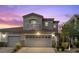 Charming two-story home with a two-car garage, Juliet balcony, and meticulously maintained front yard at 694 Value Ridge Ave, Henderson, NV 89012