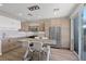 Modern kitchen featuring sleek cabinets, stainless steel appliances, and stylish pendant lighting at 694 Value Ridge Ave, Henderson, NV 89012