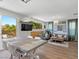Open-concept area blending indoor and outdoor living with modern furnishings at 694 Value Ridge Ave, Henderson, NV 89012