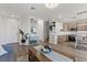 Open concept living room and kitchen with modern finishes and decor at 694 Value Ridge Ave, Henderson, NV 89012