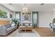Inviting living room featuring hardwood floors, comfortable seating, and stylish decor at 694 Value Ridge Ave, Henderson, NV 89012