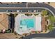 Community pool featuring clear blue water, multiple seating areas and maintained landscaping at 694 Value Ridge Ave, Henderson, NV 89012