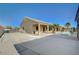 Spacious backyard with a covered patio, pool, desert landscaping, and ample parking at 6971 Moaning Cavern St, Las Vegas, NV 89131
