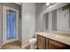 Bathroom featuring a sink and vanity, toilet and enclosed shower with a blue curtain at 6971 Moaning Cavern St, Las Vegas, NV 89131