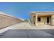 Long driveway offering ample parking, leading to the home and detached garage at 6971 Moaning Cavern St, Las Vegas, NV 89131