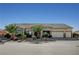 Single story home featuring desert landscaping, stone accents, tile roof, and three car garage at 6971 Moaning Cavern St, Las Vegas, NV 89131