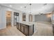 Open concept kitchen with a center island, stainless steel appliances, and view of the living area at 6971 Moaning Cavern St, Las Vegas, NV 89131