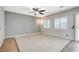 Living room features tile flooring, plantation shutters, and neutral color paint at 6971 Moaning Cavern St, Las Vegas, NV 89131