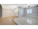 Open living area with a view of a doorway, a window with shutters, and tile flooring at 6971 Moaning Cavern St, Las Vegas, NV 89131