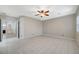 Spacious main bedroom with tile floors, a ceiling fan, shuttered windows, and ensuite bathroom at 6971 Moaning Cavern St, Las Vegas, NV 89131