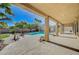Spacious covered patio overlooking the sparkling pool, spa, and backyard at 6971 Moaning Cavern St, Las Vegas, NV 89131