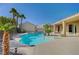 Backyard oasis featuring a gorgeous pool, spa, and covered patio area at 6971 Moaning Cavern St, Las Vegas, NV 89131