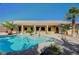 Amazing backyard featuring a large pool, patio area, and lush landscaping at 6971 Moaning Cavern St, Las Vegas, NV 89131