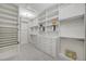 Spacious walk-in closet with custom shelving, drawers, and ample storage space at 6971 Moaning Cavern St, Las Vegas, NV 89131