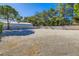 Expansive backyard with gravel, bordered by block walls, with space for customization and landscaping at 7385 Severence Ln, Las Vegas, NV 89131
