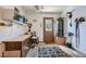 Neat garage featuring shelving, a work bench, and an adjacent water heater at 7385 Severence Ln, Las Vegas, NV 89131