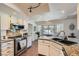 Bright kitchen boasts granite counters, stainless appliances, and a bay window with charming garden view at 7385 Severence Ln, Las Vegas, NV 89131