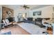 Open living space featuring a cozy fireplace, modern seating, and bar seating, perfect for entertaining and relaxing at 7385 Severence Ln, Las Vegas, NV 89131