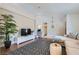 Cozy living room featuring a large TV, comfortable seating, and stylish decor at 7385 Severence Ln, Las Vegas, NV 89131